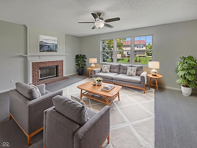 12089 Red Hawk Dr, Fishers, IN 46037 - living room featuring ceiling fan and a fireplace