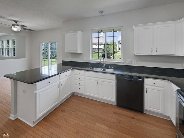 12089 Red Hawk Dr, Fishers, IN 46037 - kitchen with a peninsula, dishwasher, light wood-type flooring, a ceiling fan, and dark countertops