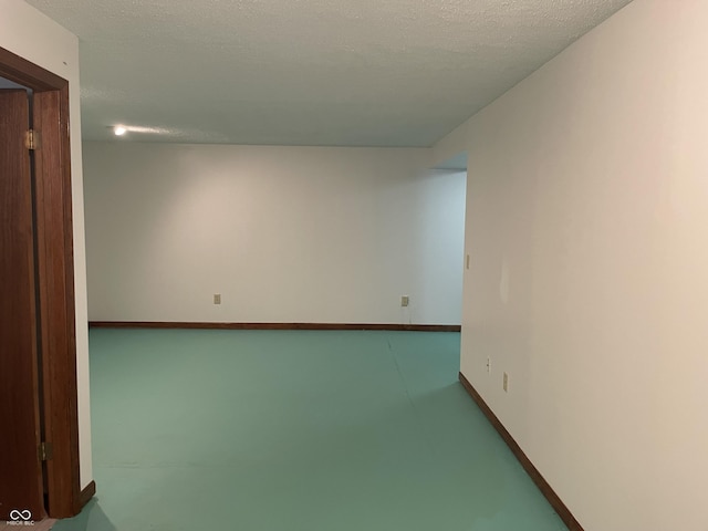 10610 Stillcreek Dr, Indianapolis, IN 46239 - empty room with a textured ceiling and finished concrete flooring