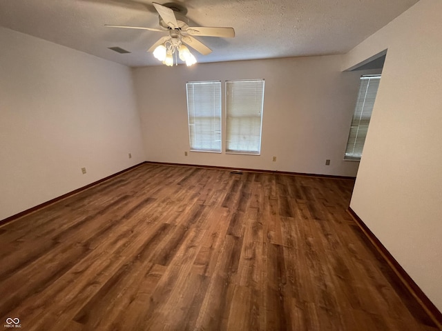 10610 Stillcreek Dr, Indianapolis, IN 46239 - unfurnished room with wood finished floors, a ceiling fan, and a textured ceiling