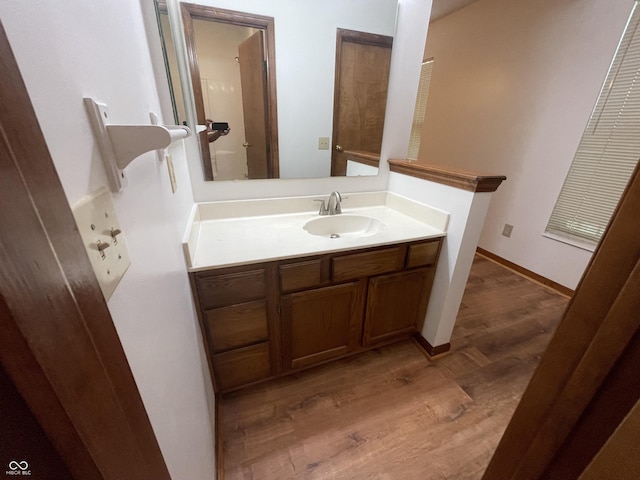 10610 Stillcreek Dr, Indianapolis, IN 46239 - bathroom with wood finished floors and vanity