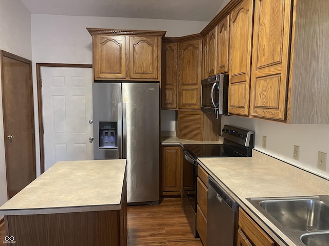 10610 Stillcreek Dr, Indianapolis, IN 46239 - kitchen with appliances with stainless steel finishes, dark wood-style floors, light countertops, and brown cabinetry