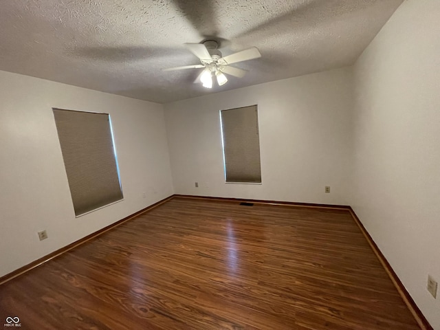 10610 Stillcreek Dr, Indianapolis, IN 46239 - empty room with wood finished floors, ceiling fan, and a textured ceiling