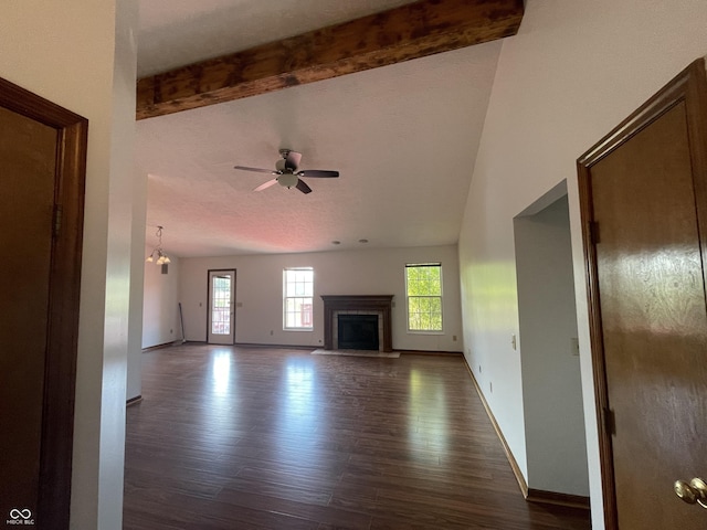 10610 Stillcreek Dr, Indianapolis, IN 46239 - unfurnished living room with dark wood-type flooring, a ceiling fan, a fireplace, and beam ceiling
