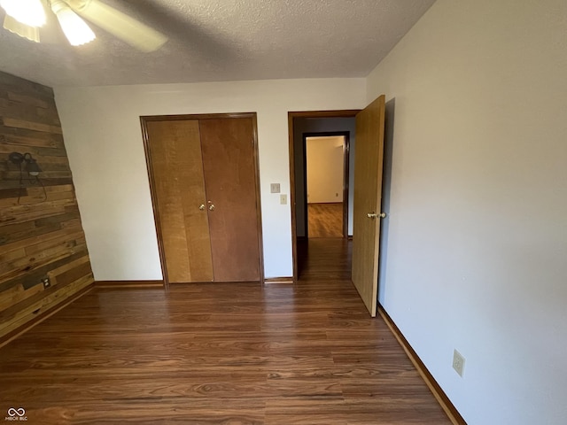 10610 Stillcreek Dr, Indianapolis, IN 46239 - unfurnished bedroom with dark wood finished floors, a textured ceiling, a closet, and ceiling fan