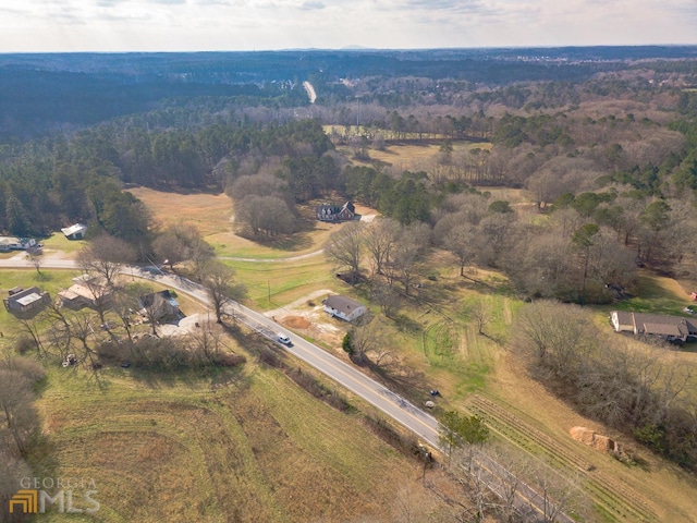 birds eye view of property featuring a rural view