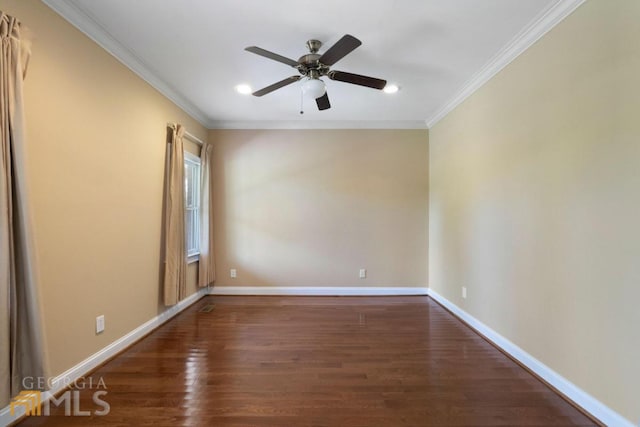 empty room with ceiling fan, ornamental molding, and dark wood-type flooring