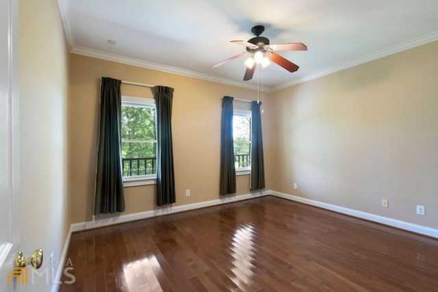 spare room with ceiling fan, crown molding, and dark hardwood / wood-style floors