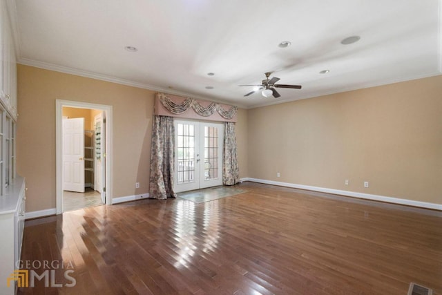 tiled empty room featuring french doors, ornamental molding, and ceiling fan