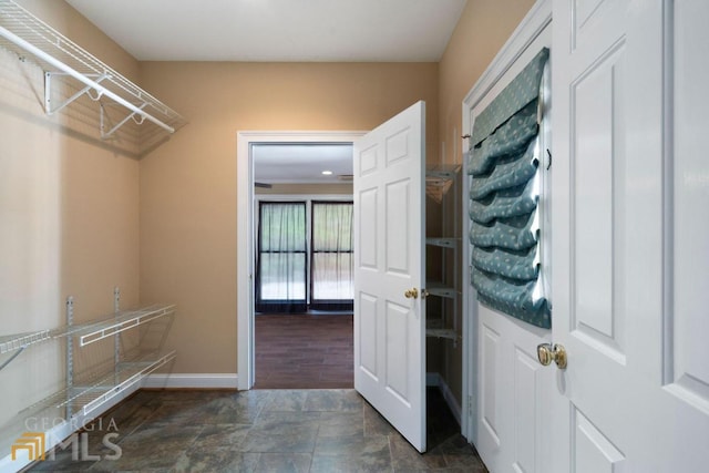 interior space featuring dark tile flooring