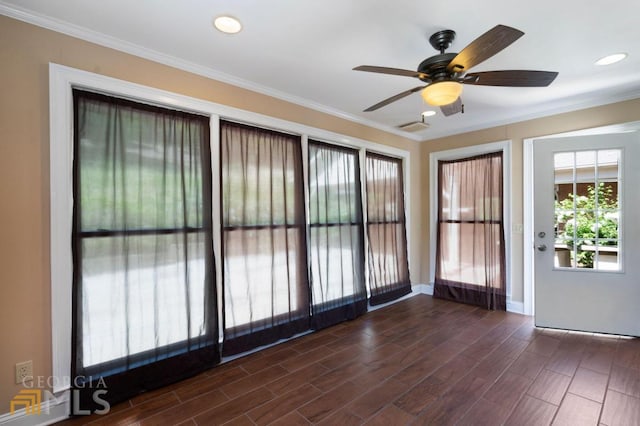 interior space featuring ceiling fan, dark hardwood / wood-style flooring, and ornamental molding