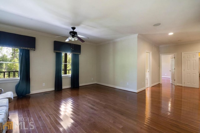 spare room with dark hardwood / wood-style floors, ornamental molding, and ceiling fan