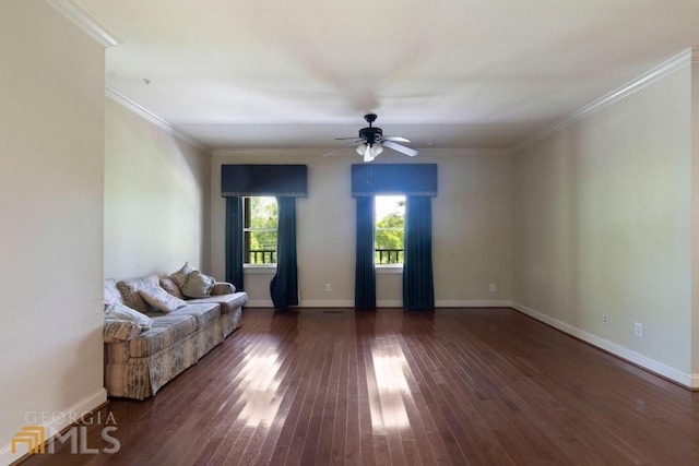 unfurnished room featuring dark hardwood / wood-style floors, ornamental molding, and ceiling fan