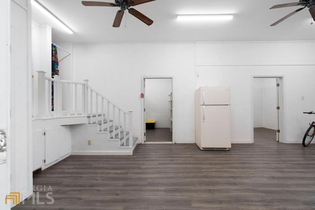 interior space with ceiling fan and dark wood-type flooring