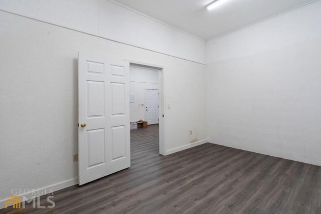 unfurnished room featuring dark hardwood / wood-style floors