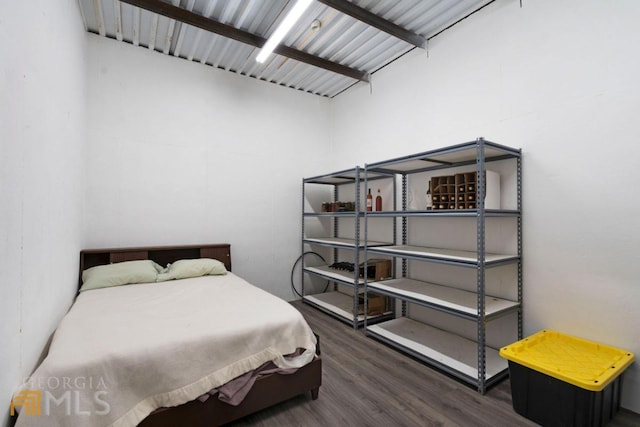 bedroom featuring dark wood-type flooring