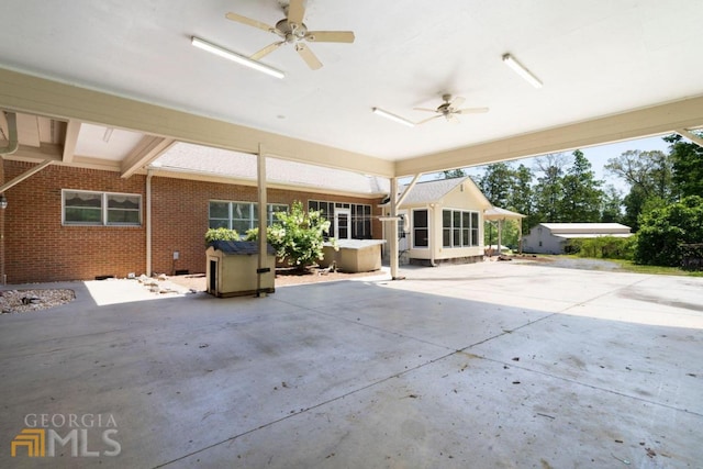 view of patio featuring ceiling fan