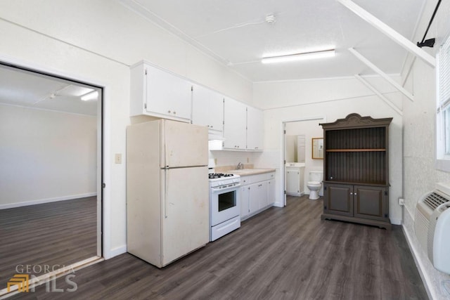 kitchen featuring dark hardwood / wood-style flooring, sink, white appliances, and white cabinetry