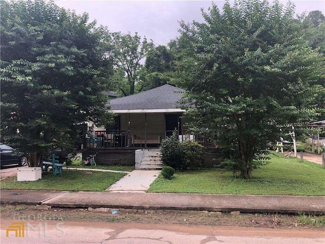 view of front of home with a front yard