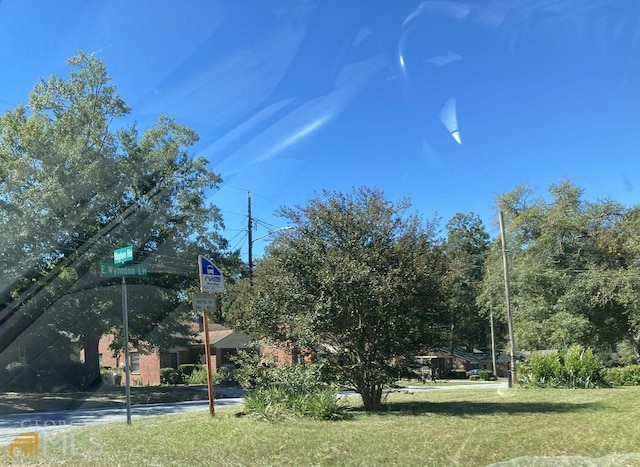 view of nearby features featuring a yard
