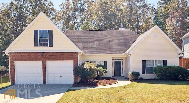1208 Bordeau Way, Villa Rica, GA 30180 - view of front of property featuring a front lawn and a garage