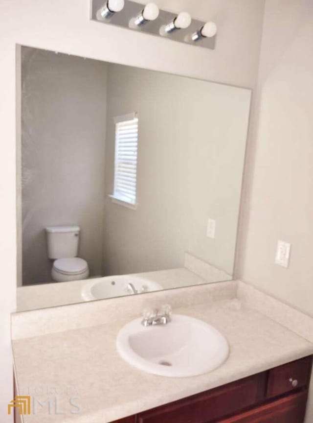1208 Bordeau Way, Villa Rica, GA 30180 - bathroom with oversized vanity and toilet