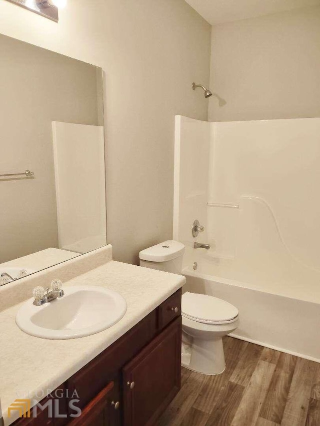1208 Bordeau Way, Villa Rica, GA 30180 - full bathroom with vanity, wood-type flooring, bathtub / shower combination, and toilet