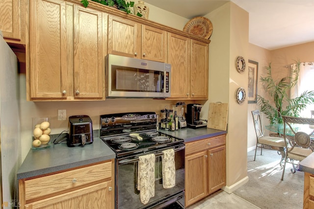 kitchen featuring black / electric stove and light colored carpet