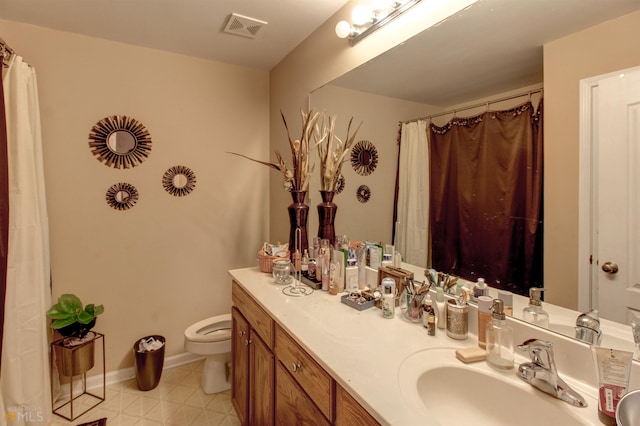 bathroom featuring dual bowl vanity, tile flooring, and toilet