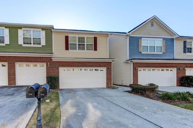 townhome / multi-family property featuring a garage