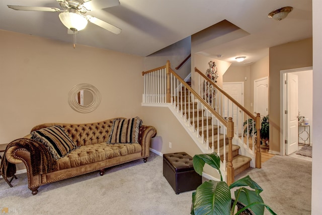 living room with ceiling fan and light carpet