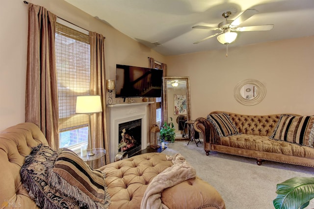 carpeted living room featuring ceiling fan