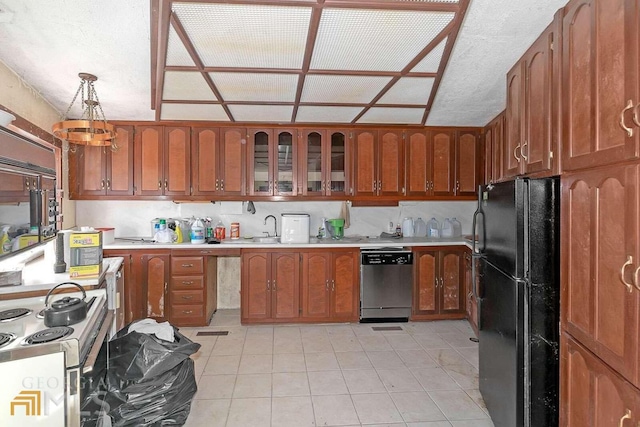 kitchen featuring electric stove, light tile floors, black refrigerator, hanging light fixtures, and stainless steel dishwasher