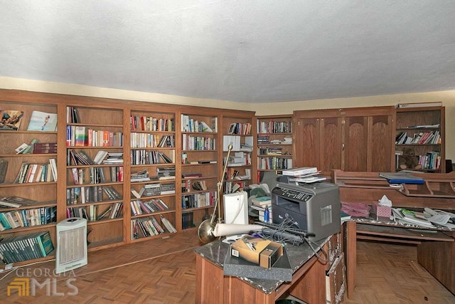 home office featuring a textured ceiling and parquet floors