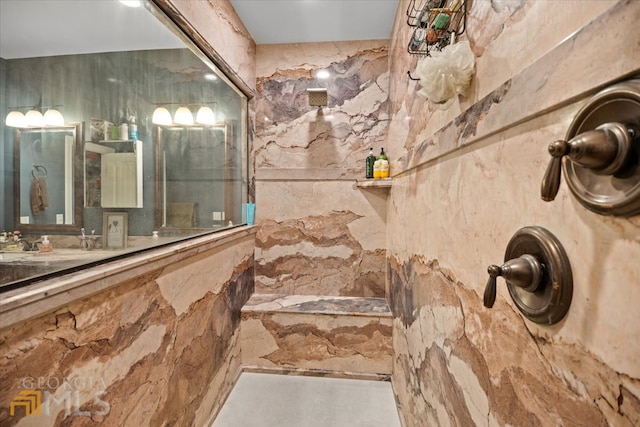 bathroom featuring tile walls and vanity