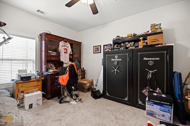 home office featuring light colored carpet and ceiling fan