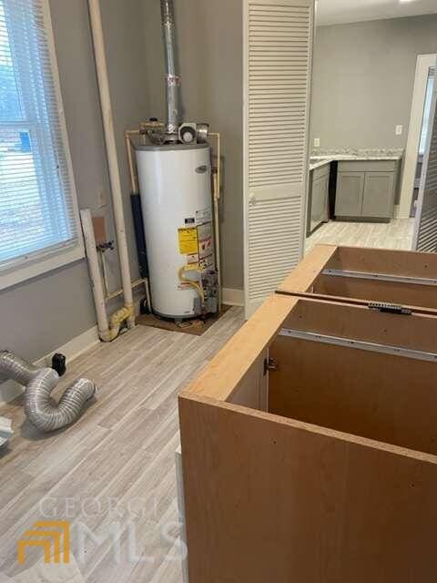 utility room with water heater