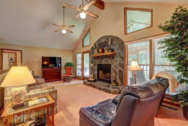 living room featuring light carpet, high vaulted ceiling, ceiling fan, and a fireplace