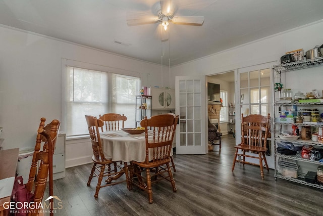 dining space with ceiling fan, ornamental molding, dark hardwood / wood-style floors, and french doors