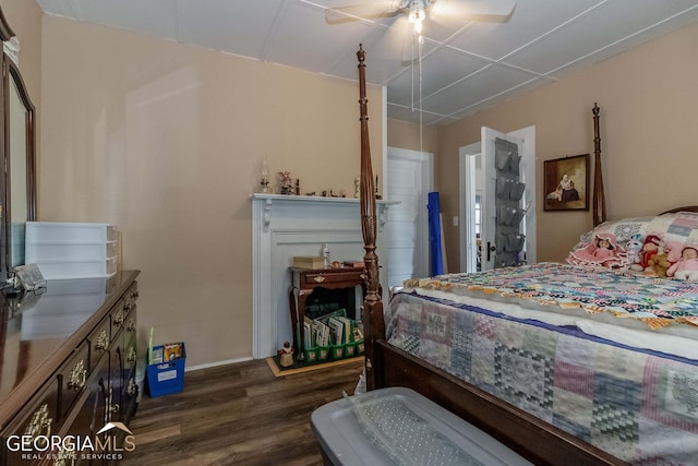 bedroom featuring ceiling fan and dark hardwood / wood-style flooring