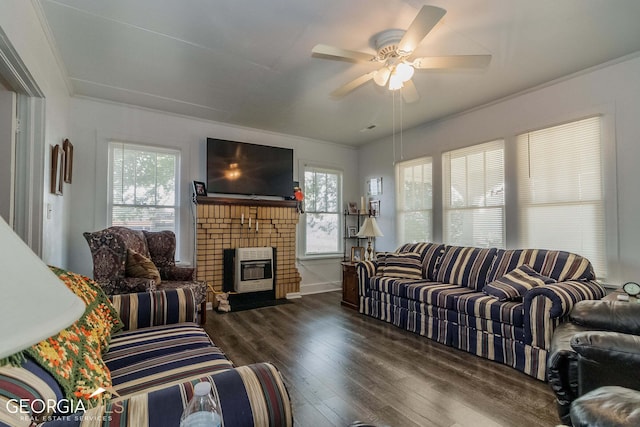 living room featuring a fireplace, ornamental molding, dark hardwood / wood-style floors, and ceiling fan