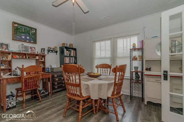 dining space featuring ceiling fan, dark wood-type flooring, and ornamental molding