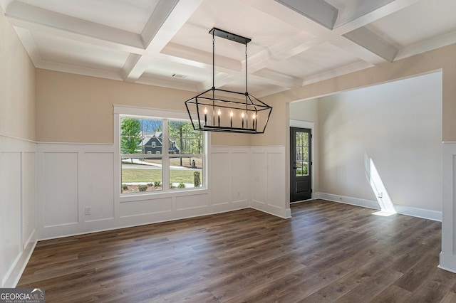 101 Bonnie Lynn Ln, Carrollton, GA 30117 - unfurnished dining area featuring a decorative wall, an inviting chandelier, beamed ceiling, dark wood finished floors, and coffered ceiling