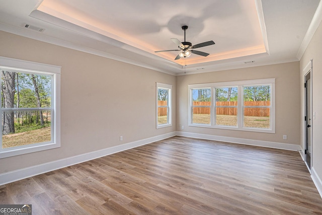 101 Bonnie Lynn Ln, Carrollton, GA 30117 - unfurnished room with a raised ceiling, wood finished floors, baseboards, and a ceiling fan