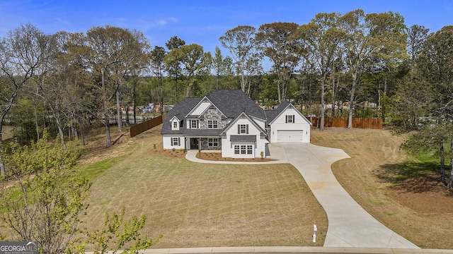 101 Bonnie Lynn Ln, Carrollton, GA 30117 - view of front of home featuring concrete driveway, a front yard, fence, and an attached garage