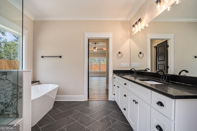 101 Bonnie Lynn Ln, Carrollton, GA 30117 - bathroom with a ceiling fan, ornamental molding, a sink, a freestanding bath, and double vanity