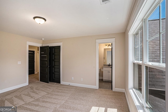 101 Bonnie Lynn Ln, Carrollton, GA 30117 - unfurnished bedroom featuring carpet flooring, baseboards, and multiple windows
