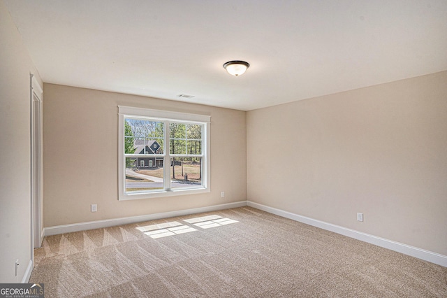 101 Bonnie Lynn Ln, Carrollton, GA 30117 - spare room with light carpet, visible vents, and baseboards