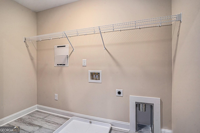 101 Bonnie Lynn Ln, Carrollton, GA 30117 - laundry room featuring laundry area, hookup for an electric dryer, washer hookup, and baseboards