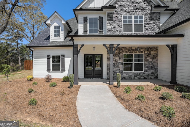 101 Bonnie Lynn Ln, Carrollton, GA 30117 - view of front of house with roof with shingles, a porch, french doors, and stone siding